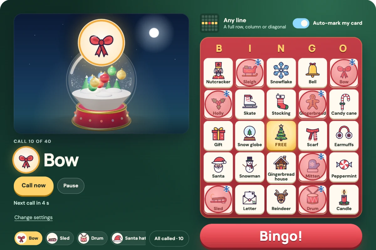 Christmas Bingo gameplay: a snow globe caller full of glowing ornaments beside a picture card with daubed stockings, snowmen and gifts
